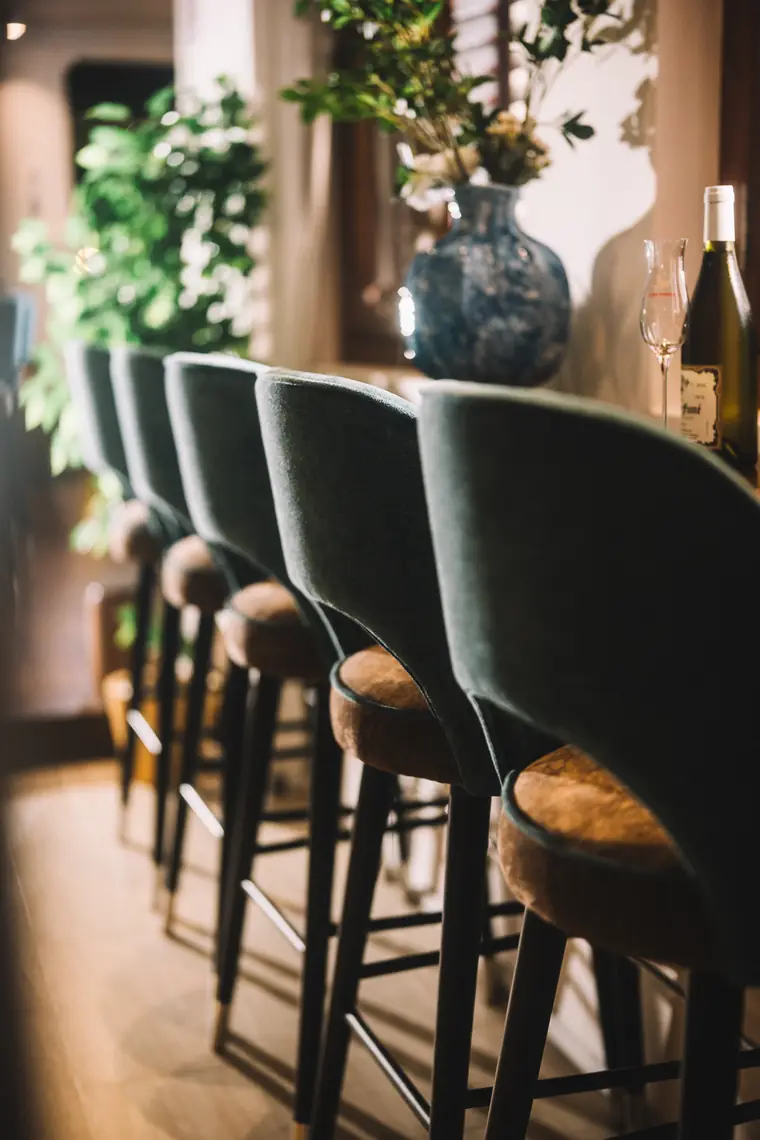 Velvet bar stools along the counter